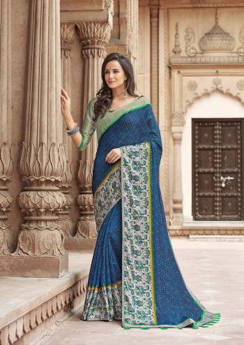 Rich And Elegant Looking Printed Saree Is Here In Blue Color Paired With Contrasting Grey Colored Blouse. This Saree IS Linen Based Paired With Satin Blouse. Buy This Saree Now.