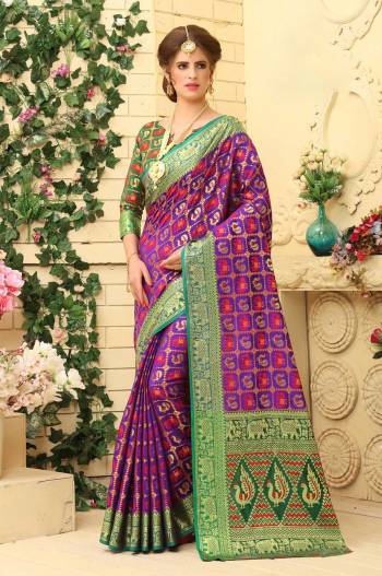 You Will Earn Lots Of Compliments Wearing This Silk Based Saree In Purple Color Paired With Contrasting Dark Green Colored Blouse. This Saree Is Fabricated Jacquard Silk Paired With art Silk Blouse. Buy Now.