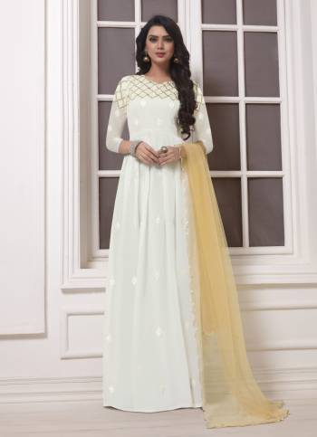 Flaunt Your Rich And Elegant Taste With This Simple And Elegant Looking Designer Floor Length Suit In White Color Top And Bottom Paired With Beige Dupatta. Its Top Is Georgette Based Paired With Santoon Bottom And Net Dupatta. Buy This Now.