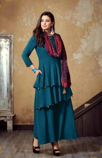 Here Is Designer Layered Pattern Readymade Long Kurti In Blue Color Paired With Contrasting Magenta Pink Colored Scarf. This Kurti Is Rayon Fabricated Paired With Muslin Cotton Scarf. It Is Light Weight And Easy To Carry All Day Long.