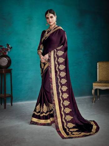 Add This Lovely Shade To Your Wardrobe With this Heavy Designer Saree In Wine Color Paired With Wine Colored Blouse. This Saree Is Fabricated On Satin Silk Paired With Art Silk Fabricated Blouse. It Is Beautified With Heavy Jari And Stone Work.