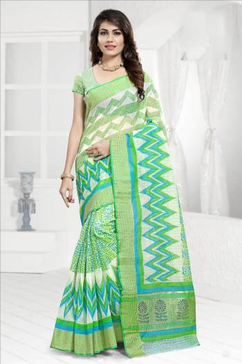 Simple And Elegant Looking Saree Is Here For Your Semi-Casual Wear Is Here In Green and White Color Paired With Green and White Colored Blouse. This Saree And Blouse Are Cotton Based Beautified With Prints All Over It. 