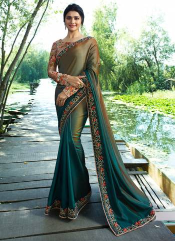 You Will Definitely Earn Lots Of Compliments Wearing This Designer Saree In Olive And Teal Green Color Paired With Contrasting Dusty Pink Colored Blouse. This Saree Is Soft Silk Based Paired with Sparkle Silk Fabricated Blouse. It Has Lovely Floral Prints With Heavy Embroidery Work.