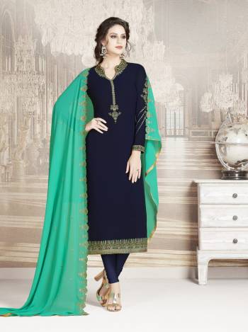 Enhance Your Personality Wearing This Designer Straight Suit In Navy Blue Color Paired With Contrasting Sea Green Colored Dupatta. Its Top And Dupatta Are Georgette Fabricated Paired With Santoon Bottom. Buy Now.