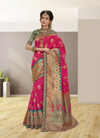 Attract All Wearing This Saree In Fuschia Pink Color Paired With Contrasting Green Colored Blouse. This Saree And Blouse Are Fabricated On Jacquard Silk Beautified With Weave And Embroidered Lace Border. Buy Now.