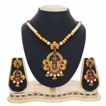 Here Is Beautiful And Royal Looking Necklace Set In Golden Color Beautified with Magenta Pink Colored Stone Work. It Is Best Suitable With Silk Saree Which Gives A Rich Look To Your Personality. Buy Now.