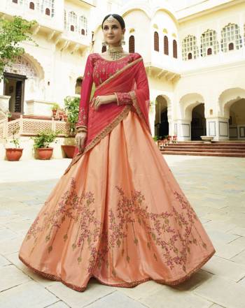 Here Is A Lovely Color Pallet Which Is Must Have In Every Womens Wardrobe, Grab This Designer Lehenga Choli Is Dark Pink Colored Blouse And Dupatta Paired With Peach Colored Lehenga. Its Blouse Is Satin Silk Based Paired With Soft Silk Lehenga And Net Dupatta. Buy This Lehenga Choli Now.