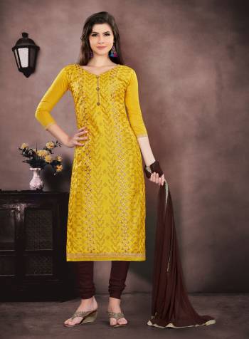 Here Is An Attractive Looking Dress Material In Yellow Colored Top Paired With Brown Colored Bottom And Dupatta. Get This Beautiful Dress Material Stitched As Per Your Desired Fit And Comfort. Buy Now.