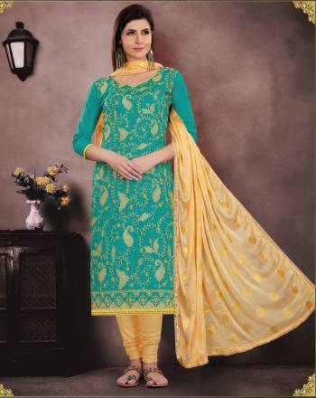 Add This Pretty Suit to Your Wardrobe In Turquoise Blue Color Paired With Golden Colored Bottom And Dupatta. Its Top And Bottom Are Fabricated On Cotton Paired With Chiffon Dupatta. 