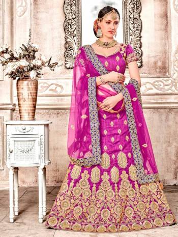 Attract All Wearing This Bright Colored Designer Lehenga Choli In Magenta Pink color Paired With Magenta Pink Colored Dupatta. Its Blouse And Lehenga Are Fabricated On Art Silk Paired With Net Fabricated Dupatta. Buy Now.