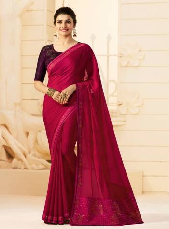 Bright And Visually Appealing Color Is Here With This Lovely Rani Pink Colored Saree Paired With Contrasting Purple Colored Blouse. This Saree Is Fabricated On Georgette Paired With Art Silk Fabricated Blouse. 