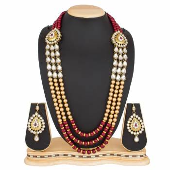 Be It A Simple Kurti Or Suit OR A Saree, This Necklace Set Is Suitable For All.Grab This Necklace Set In Beige And Maroon Color Beautified With Moti And Stone Work. Buy Now.