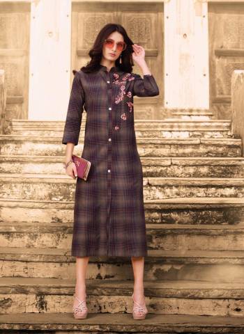 Add This Beautiful Designer Readymade Kurti In Dark Purple Color Fabricated On Soft Cotton Beautified With Checks Prints And Thread Work. It Is Available In All Sizes.