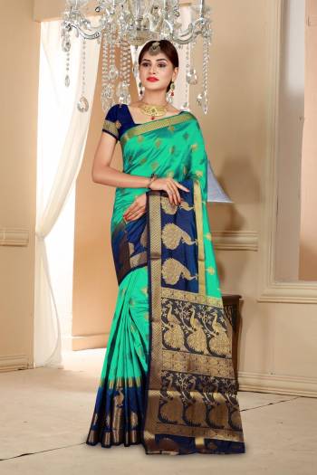 Here Is an Attractive Sea Green Colored Saree Paired With Contrasting Navy Blue Colored Blouse. This Saree And Blouse Are Fabricated On Art Silk Beautified With Weave All Over. Buy Now.