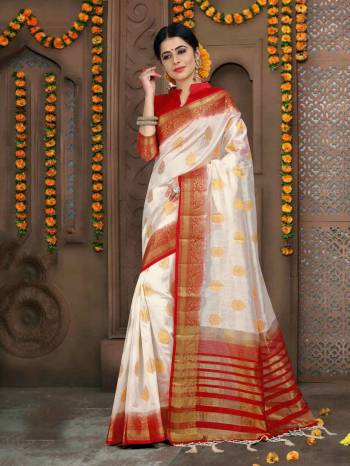 Simple And Elegant Looking Saree Is Here In White Color Paired With Red Colored Blouse. This Saree And Blouse Are Art Silk Based Beautified With Weave All Over.