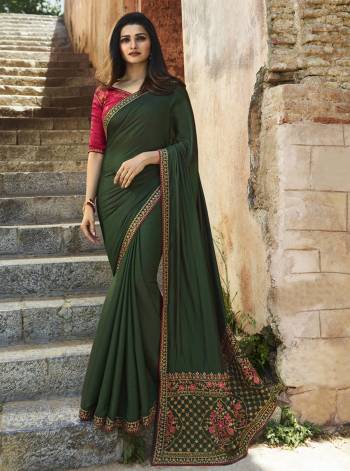 Enhance Your Personality Wearing This Designer Saree In Dark Olive Green Color Paired With Contrasting Dark Pink Colored Blouse. This Saree Is Fabricated On Soft Silk Paired With Art Silk Fabricated Blouse. It Has Attractive Embroidery Over The Pallu And Blouse With Embroidered Lace Border.