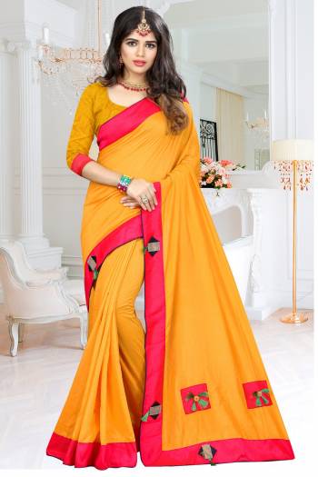 Celebrate This Festive Season with This Attractive Looking Musturd Yellow Colored Saree Paired With Musturd Yellow Colored Blouse. This Saree And Blouse are Fabricated On Soft Silk Beautified With Patch Work With Fancy Button And Tassels. 