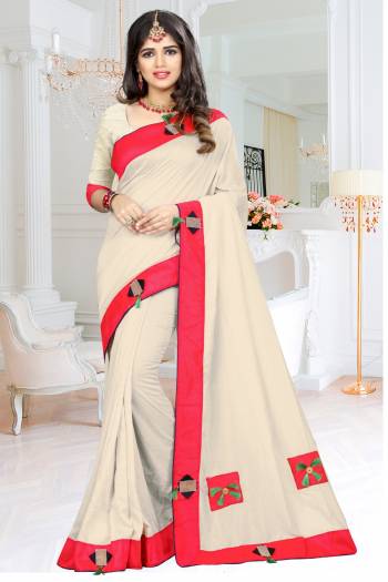 Simple And Elegant Looking Designer Saree Is Here In Off-White Color Paired With Off-White Colored Blouse. This Saree And Blouse Are Fabricated On Soft Silk Beautified With Patches, Buttons And Tassels.