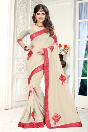 Simple And Elegant Looking Designer Saree Is Here In Off-White Color Paired With Off-White Colored Blouse. This Saree And Blouse Are Fabricated On Soft Silk Beautified With Patches, Buttons And Tassels.