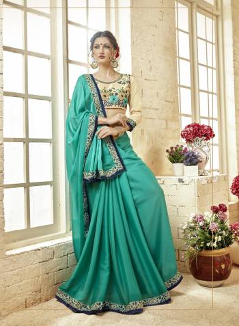 Here Is A Very Pretty Looking Designer Suit Is Here In Turquoise Blue Color Paired With Cream Colored Blouse. This Saree Is Fabricated On Silk Georgette Paired With Art Silk Fabricated Blouse. Buy Now.