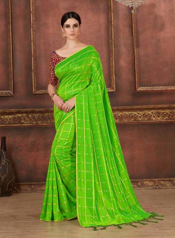 Appealing Color Is Here With This Saree In Parrot Green Color Paired With Contrasting Wine Colored Blouse. This Saree Is Fabricated On Soft Silk Paired With Art Silk Fabricated Blouse. Buy This Saree Now.