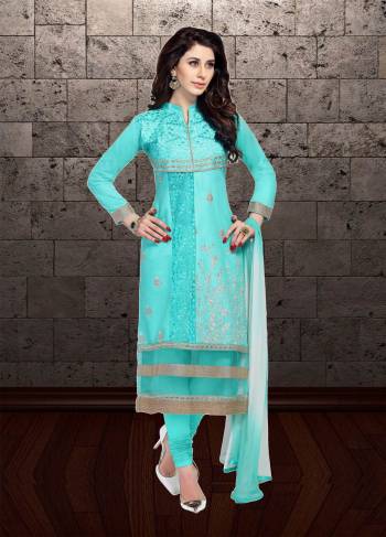 For Your Semi-Casual Wear, Grab This Pretty Straight Suit In Turquoise Blue Color Paired With White Colored Bottom And Shaded Dupatta. Its Top And Bottom Are Cotton Based Paired With Chiffon Dupatta. Buy Now.