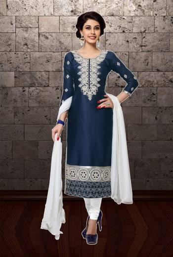 Simple Straight Suit For Your Semi-Casual Wear Is Here With This Navy Blue Colored Suit Paired With White Colored Bottom And Dupatta. Its Top And Bottom Are Cotton Based Paired With Chiffon Dupatta. Buy Now.