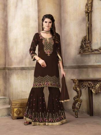 For A Bold And Beautiful Look, Grab This Designer Semi-Stitched Sharara Suit In Brown Color. Its Is all Over Brown In Georgette Based Top And Sharara Paired With Chiffon Dupatta. Its Top And Bottom Are Beautified With Attractive Embroidery. Buy Now.