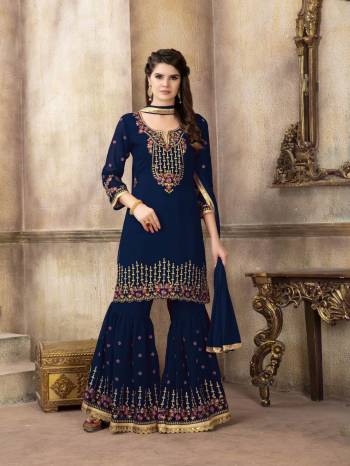 For A Bold And Beautiful Look, Grab This Designer Semi-Stitched Sharara Suit In Navy Blue Color. Its Is all Over Navy Blue In Georgette Based Top And Sharara Paired With Chiffon Dupatta. Its Top And Bottom Are Beautified With Attractive Embroidery. Buy Now.