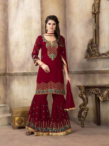 For A Bold And Beautiful Look, Grab This Designer Semi-Stitched Sharara Suit In Maroon Color. Its Is all Over Maroon In Georgette Based Top And Sharara Paired With Chiffon Dupatta. Its Top And Bottom Are Beautified With Attractive Embroidery. Buy Now.