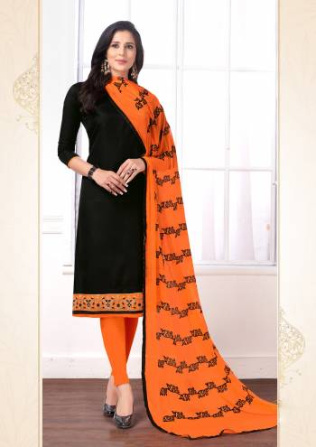 Enhance Your Personality Wearing This Designer Dress Material In Black Colored Top Paired With Contrasting Orange Colored Bottom And Dupatta. Its Top And Bottom Are Cotton Based Paired With Chiffon Dupatta Beautified With Resham Work. 