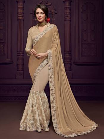 Presenting this beige color Designer imported fabrics saree. Ideal for party, festive & social gatherings. this gorgeous saree featuring a beautiful mix of designs. Its attractive color and designer imported heavy embroidered design, flower design and moti design, stone design, beautiful floral design work over the attire & contrast hemline adds to the look. Comes along with a contrast unstitched blouse.