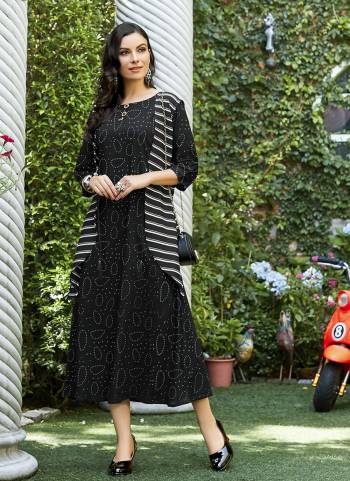 Simple Kurti IS Here For Your Casual Or Semi-Casual Wear In Black Color Which Is Rayon Based. It Is Beautified With Unique Prints. Buy Now.