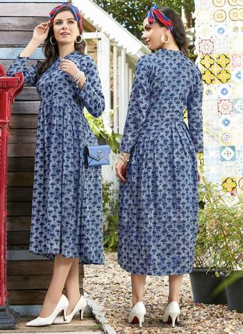 Grab This Pretty Piece For Your Semi-Casuals In Shades Of Blue. It IS Fabricated On Rayon Beautified With Prints all Over It. Also You Can Wear This With Or Without Bottom. 