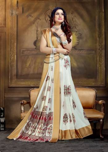 Simple Saree If Here For Your Semi-Casual Wear In White Color Paired With White Colored Blouse. This Saree And Blouse Are Silk based Beautified With Prints All Over It. 