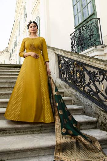 Go With The Shades Of Green Wearing This Pear Green Colored Designer Floor Length Suit Paired With Pine Green Colored Dupatta. Its Top Is Fabricated On Art Silk Paired With Banarasi Silk Dupatta. This Unique Color Pallete Will earn You Lots Of Compliments From Onlookers.