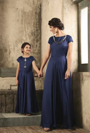 Elegant Looking Designer Floor Length Gown IS Here Available For You And Your Daughter In Navy Blue Color. This Pretty Gown Is Fabricated On Satin Which Is Comfortable For Both The Age Group. Buy Now.