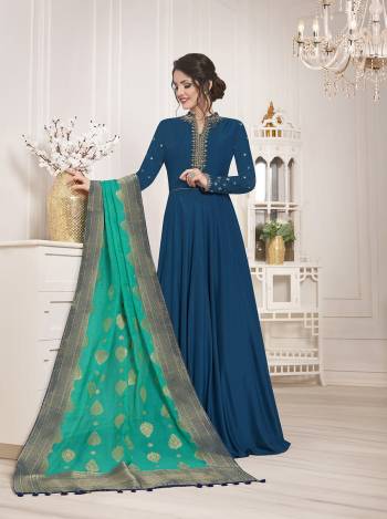 Enhance Your Personality Wearing This Designer Floor Length Semi-Stitched Suit In Blue Color Paired With Contrasting Sea Green Colored Dupatta. Its Top Is Fabricated On Muslin Silk Paired With Santoon Bottom And Banarasi Silk Dupatta. 