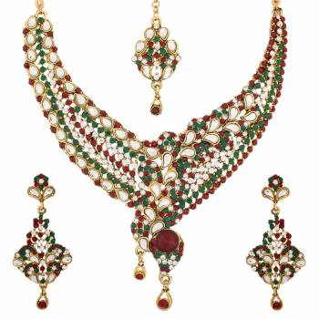 Grab This Traditional Looking Red And Green Colored Stone Work Necklace Set. This Necklace Set Be Paired With Same Or Any Contrasting Colored Traditional Attire. Buy Now.