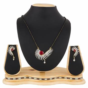 Give An Elegant Look To Your Neckline With This Rich Designer Mangalsutra Set Beautified With Diamond Work. Also It Comes With A Pair OF Earrings. Pair This Up With Any Colored Attire, Be It Casual Or Heavy. 