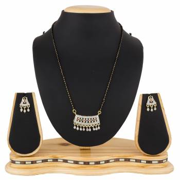 Give An Elegant Look To Your Neckline With This Rich Designer Mangalsutra Set Beautified With Diamond Work. Also It Comes With A Pair OF Earrings. Pair This Up With Any Colored Attire, Be It Casual Or Heavy. 