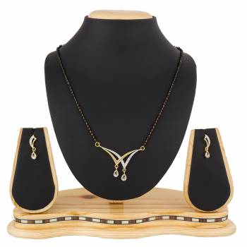 Give An Elegant Look To Your Neckline With This Rich Designer Mangalsutra Set Beautified With Diamond Work. Also It Comes With A Pair OF Earrings. Pair This Up With Any Colored Attire, Be It Casual Or Heavy. 