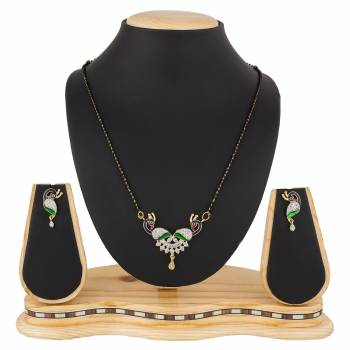 Give An Elegant Look To Your Neckline With This Rich Designer Mangalsutra Set Beautified With Diamond Work. Also It Comes With A Pair OF Earrings. Pair This Up With Any Colored Attire, Be It Casual Or Heavy. 