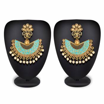 Here Is A Lovely Pair Of Earrings In Golden Color With Sky Blue Highlight And Stone Work. This Can Be Paired With Any Heavy Attire Or A Simple Kurti .