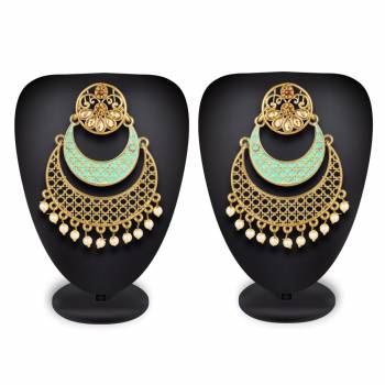 Here Is A Lovely Pair Of Earrings In Golden Color With Sky Blue Highlight And Stone Work. This Can Be Paired With Any Heavy Attire Or A Simple Kurti .