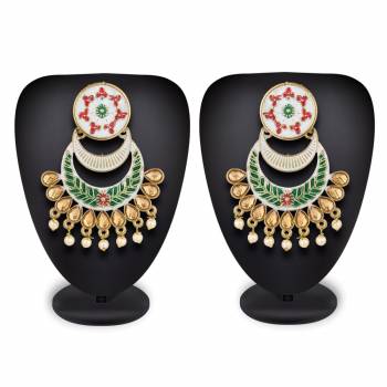 For A Proper Traditional Touch Grab This Pair Of Earrings In White Color Which Can Be Paired With Any Colored Attire. Buy This Lovely Set Now.