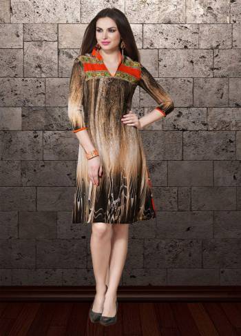 For Your Casual Or Semi-Casual Wear Grab This Readymade Kurti In Brown And Cream Color Fabricated On Georgette Beautified With Prints All Over .