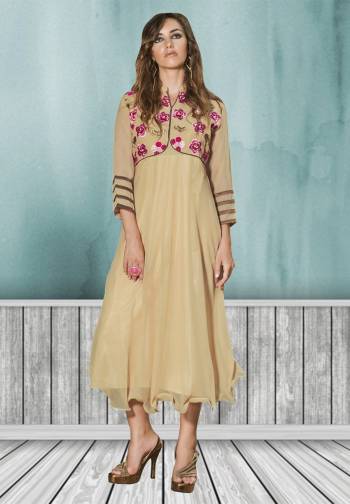 Upgade your traditional wear collection with this kurti. This pretty kurti has pink and beige colored lovely floral embroidery pattern on the neck line. The beige colored kurti is fabricated in georgette, while the inner is made of santoon fabric. Get this gorgeous kurti now.