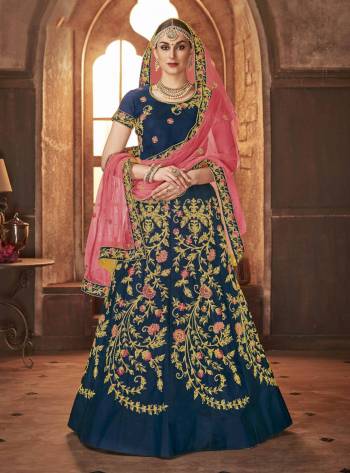 Add This Beautiful Heavy Designer Lehenga Choli In Blue Color Paired With Contrasting Pink Colored Dupatta. Its IS Satin Silk Based Paired With Net Fabricated Dupatta. Buy This Now.