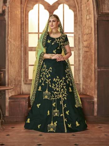 You Will Definitely Earn Lots Of Compliments Wearing This New Shades In Green With This Heavy Designer Lehenga Choli In  Pine Green Color Paired With Light Green Colored Dupatta. Its Blouse And Lehenga Are Satin Silk Based Paired With Net Fabricated Dupatta. 